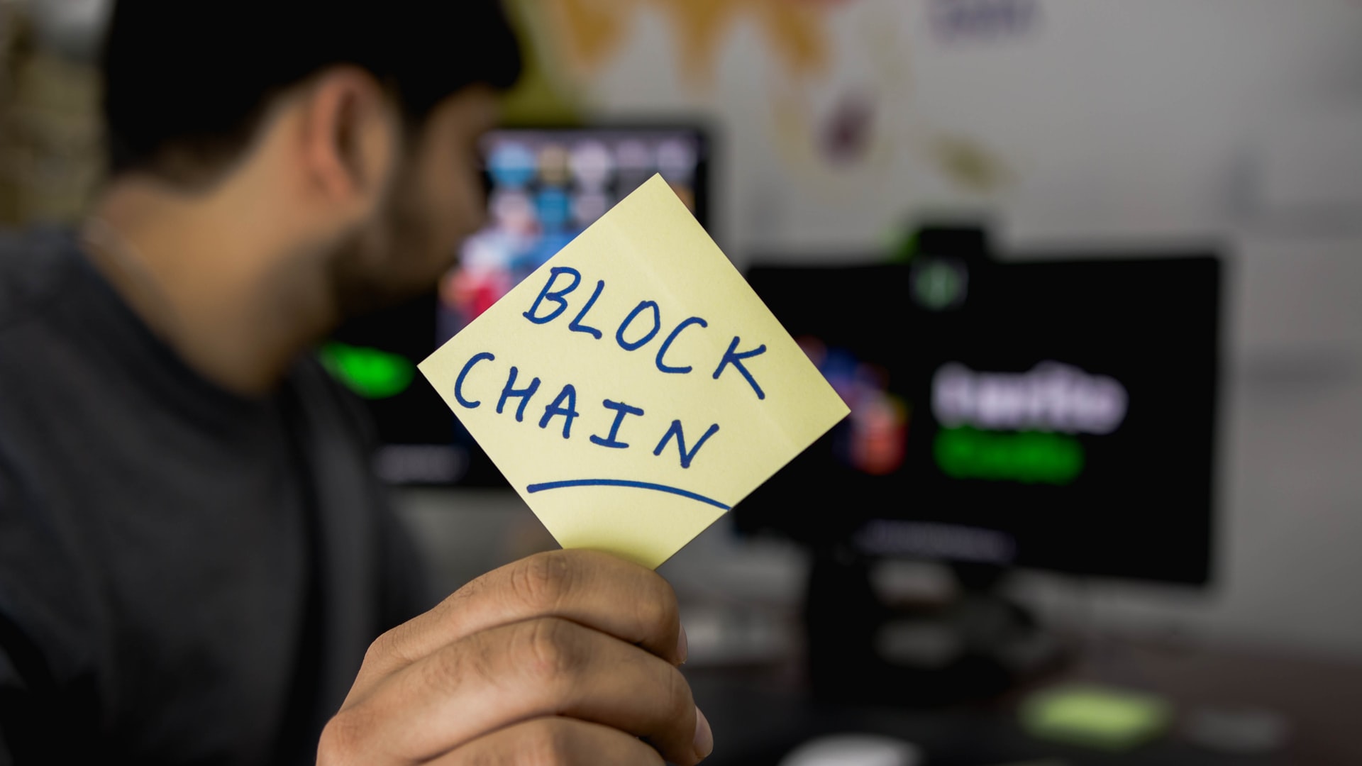 Blockchain written on a sticky note