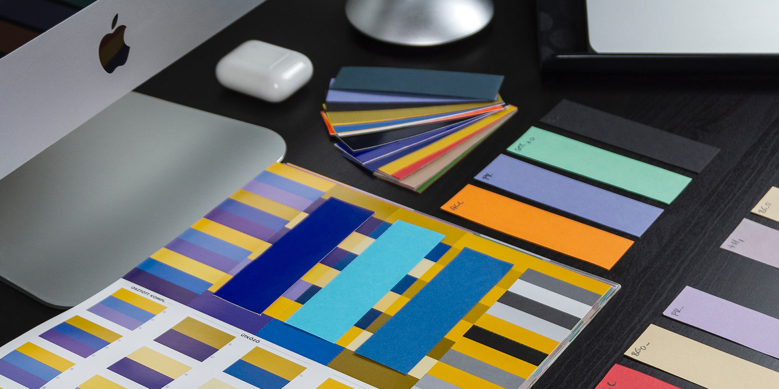 A photo of a computer table with different palettes